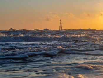 Scenic view of sea against sky during sunset