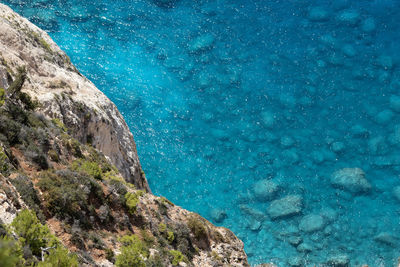 High angle view of rock formation in sea