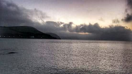 VIEW OF SEA AGAINST CLOUDY SKY