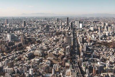 High angle view of modern buildings in city against sky