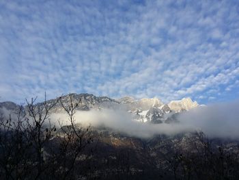 Scenic view of snowcapped mountains against sky