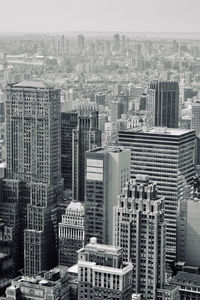 High angle view of modern buildings in city against sky