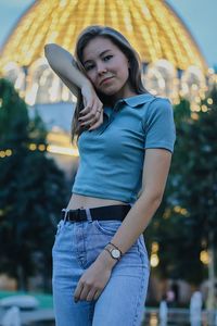 Portrait of young woman standing outdoors