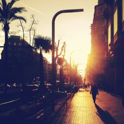 View of city street at sunset