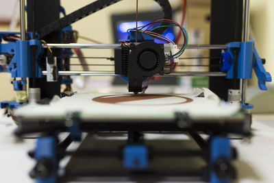 Close-up of 3d printer on table at office