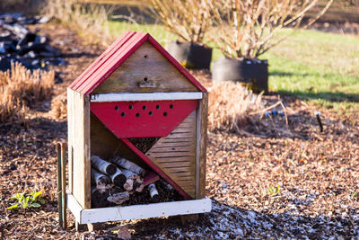 Close-up of birdhouse on field