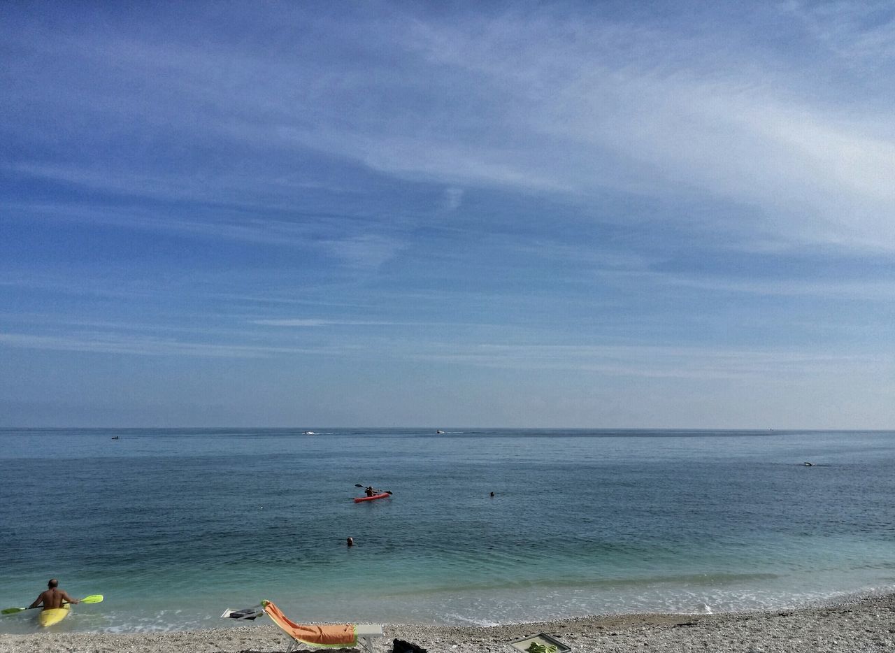 sea, horizon over water, water, beach, sky, scenics, beauty in nature, shore, tranquil scene, tranquility, nature, idyllic, blue, nautical vessel, cloud - sky, incidental people, seascape, outdoors, vacations, wave