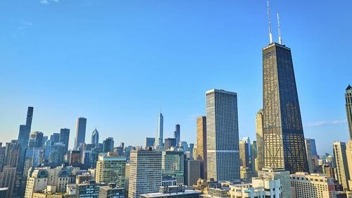 Modern buildings in city against sky