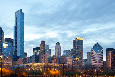 Modern buildings in city against sky