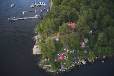 High angle view of people by boats on sea
