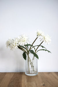 Close-up of white flower vase on table