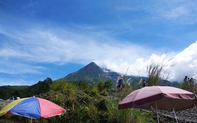 Scenic view of mountain against blue sky during sunny day