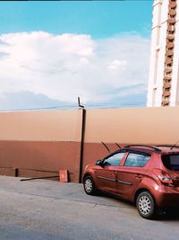 Cars on road against sky