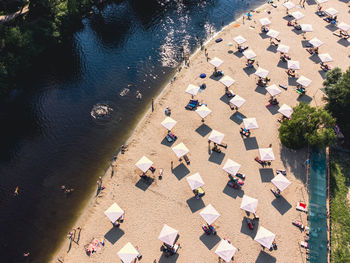 High angle view of people relaxing on beach