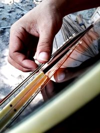 Cropped image of man playing guitar