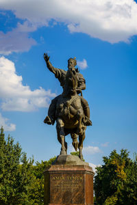 Low angle view of statue against sky