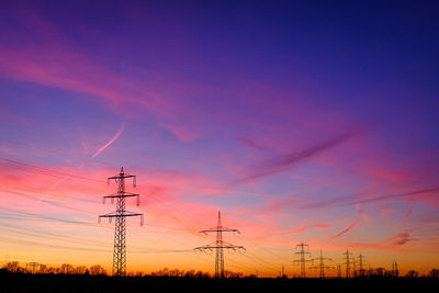 Power lines in the red evening sky