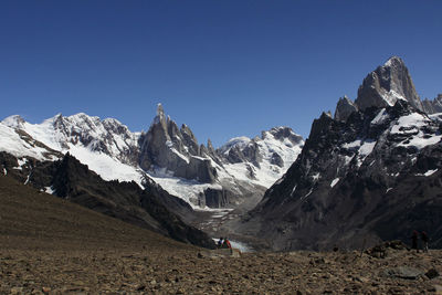 Scenic view of snowcapped mountains against clear blue sky ar fitz roy range