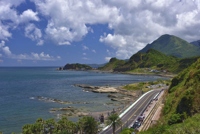 Panoramic view of road by sea against sky
