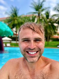 Portrait of smiling man in swimming pool