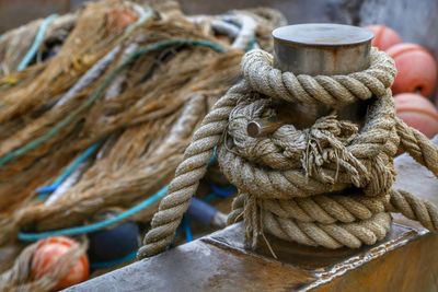 Close-up of rope tied on wooden post