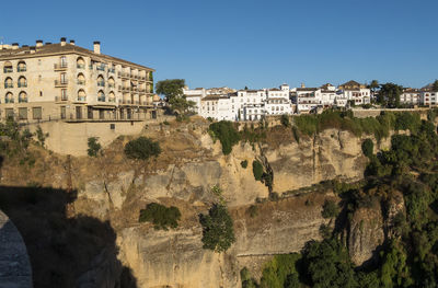 Rock formations against clear blue sky
