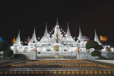 View of illuminated building against sky at night