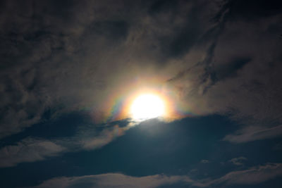 Low angle view of sun in sky during sunset