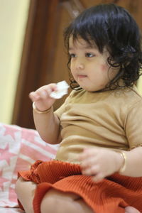 Cute girl sitting at home