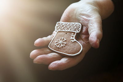 Close-up of man holding ginger boot