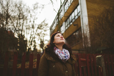 Portrait of a young woman looking away