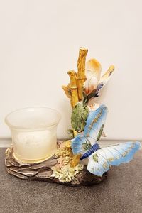 Close-up of drink on table against white background