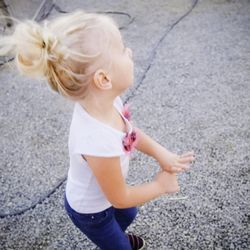 High angle view of girl standing on road