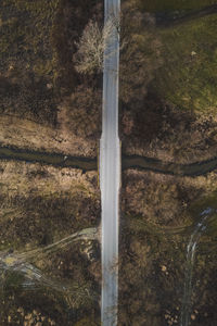 Aerial view of road amidst field