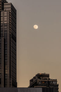 Low angle view of buildings against sky during sunset
