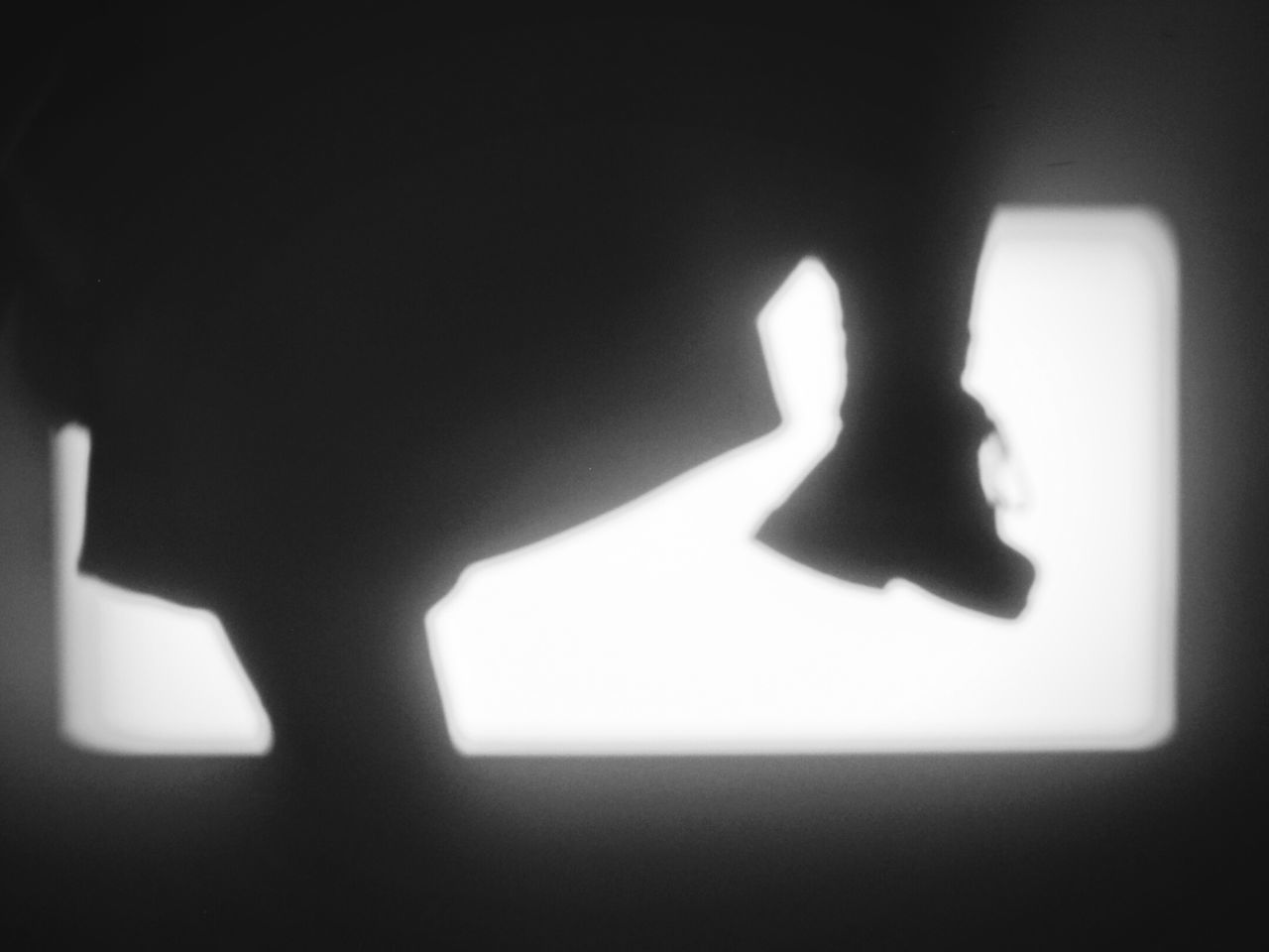 CLOSE-UP OF HUMAN HAND WITH SHADOW ON THE FLOOR