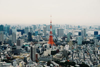 Tokyo tower in city against clear sky