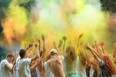 People enjoying with powder paint during holi