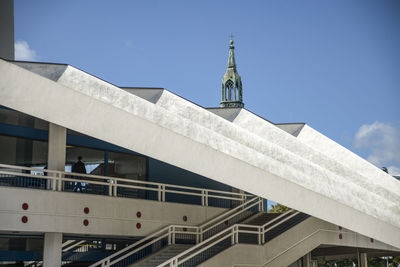 Low angle view of bridge and building against sky