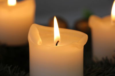 Close-up of illuminated tea light candle