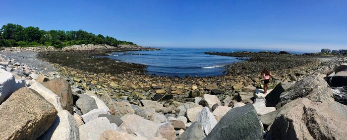 Scenic view of sea against clear blue sky