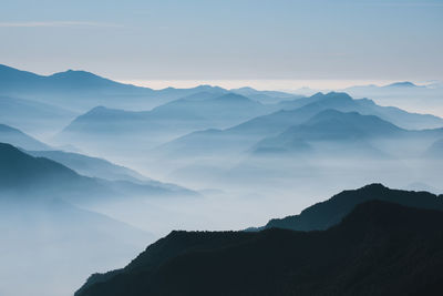 Silhouette of mountains looking like sheets of papers during sunrise at uttarakhand, india