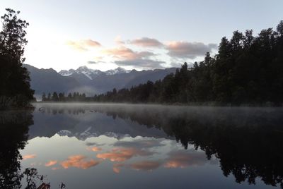 Scenic view of lake against sky during sunset