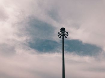 Low angle view of communications tower against sky