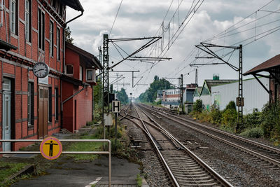 View of railway tracks against cloudy sky