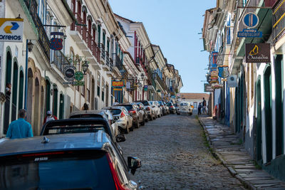 Panoramic view of street amidst buildings against sky