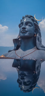 Low angle view of statue against sky