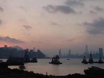 Scenic view of bay against sky during sunset