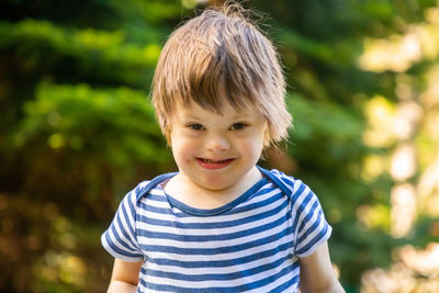 Portrait of boy smiling outdoors