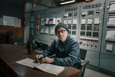 Portrait of young man working in workshop